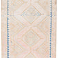 Zoomed out view of beige wool runner rug with repeating diamond motif