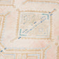Close up of weave work of beige wool runner rug with repeating diamond motif