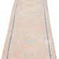 Beige wool runner rug with repeating diamond motif