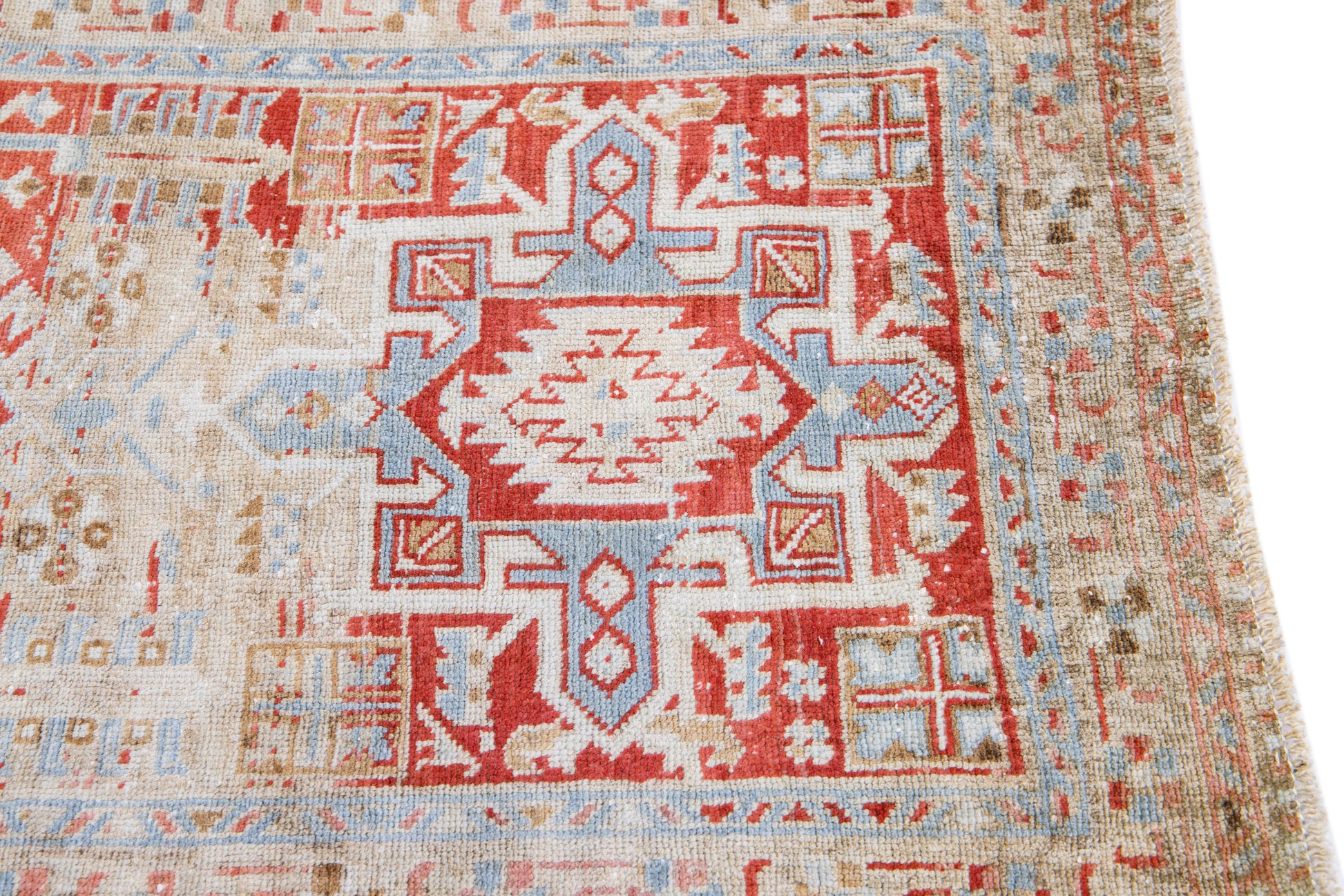 Close up of natural fading of handmade red wool runner 